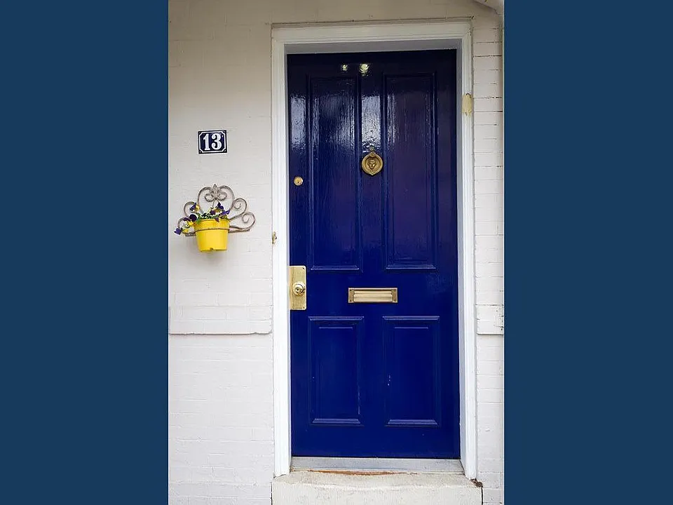 Quiet friendly street. Pretty front yard. Front door