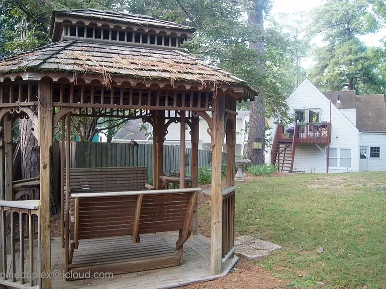 Spacious backyard with gazebo, firepit, patio, and plenty of space for a small garden.
