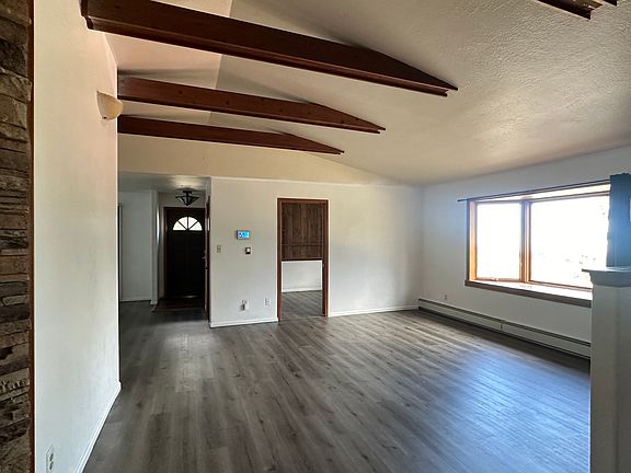 spacious living area with natural light and amazing view of the city at night!