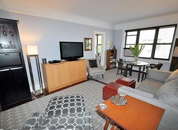 The living room and dining foyer have been opened to create a massive space.  The living room has a cove ceiling, picture molding and refinished hardwood floors.  The living room is 23'-6"  x 12'-6" and the dining foyer is 15'-0" x 8'-0".