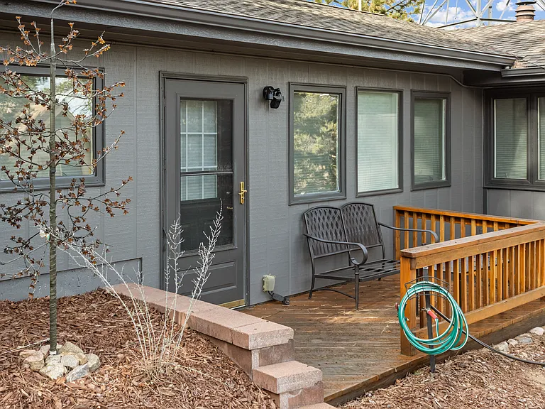 Private deck off of the primary bedroom suite with sitting area.