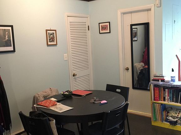 Dining nook or desk area w/ ceiling fan; Closet #2 center-rear; door to bathroom to closet's right (with prior, dark, flooring)