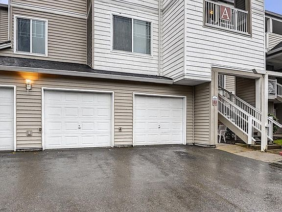 Garage in the middle is yours. Goes directly into the unit