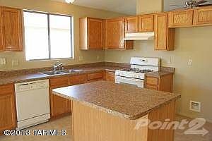 Open Kitchen with Rich Wood Cabinets