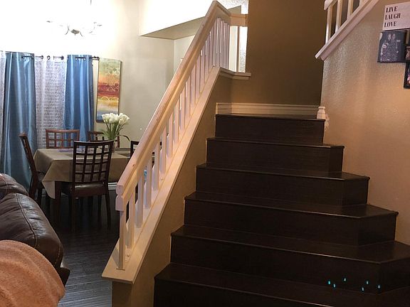 New laminate floors in the living room, dining area, stairs, upstairs hallway, and all bedrooms