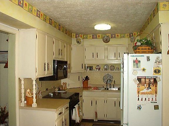 Cozy kitchen has three work stations