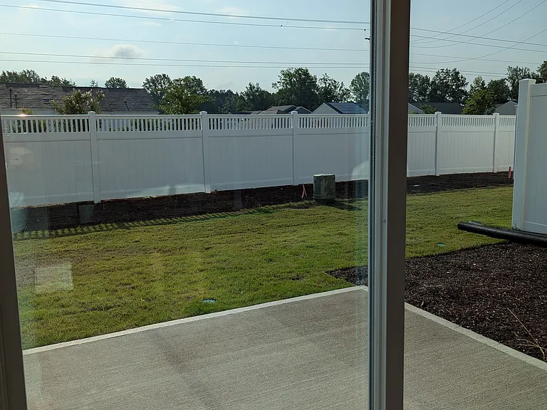 Back patio, yard and privacy fencing