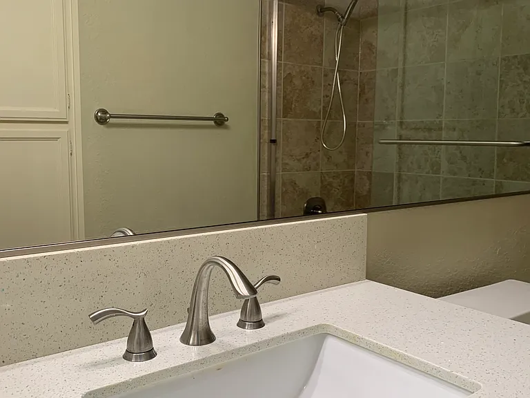2nd bedroom bathroom with storage cabinets