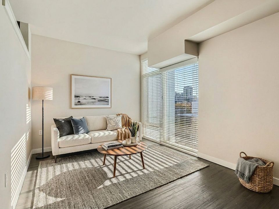 Tall windows wrap this living room in natural light all day long.