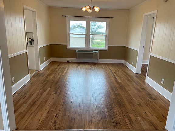 Plenty of room in this 12'x16' dining room with newly restored hardwood flooring.