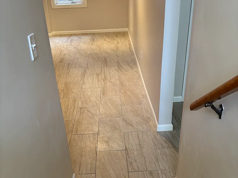 Stairway lands in entry facing bonus room