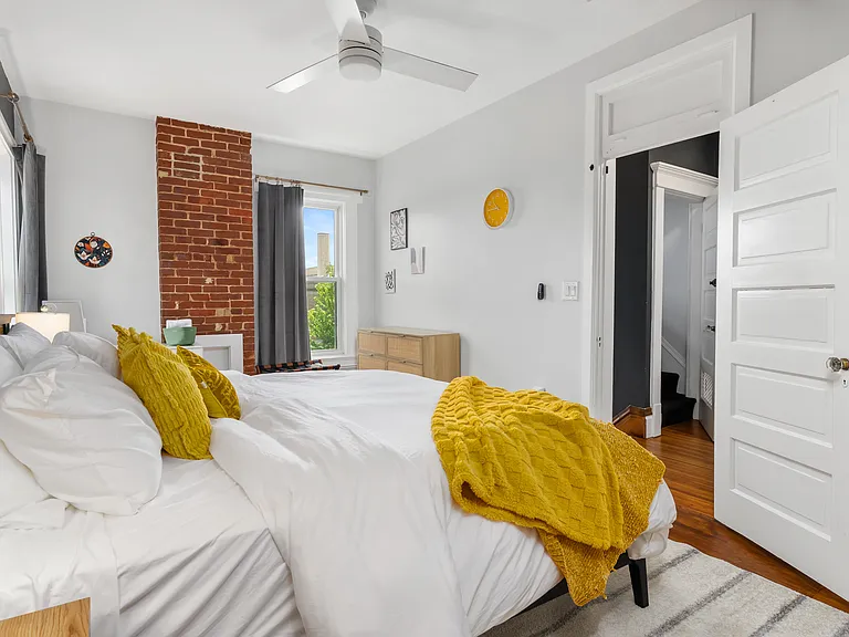 Primary bedroom with ensuite bathroom. King size bed.