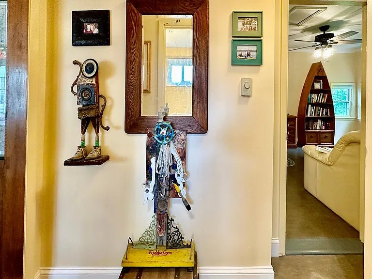 Quirky art and cultural items are showcased around the quaint cottage providing interest around every corner.