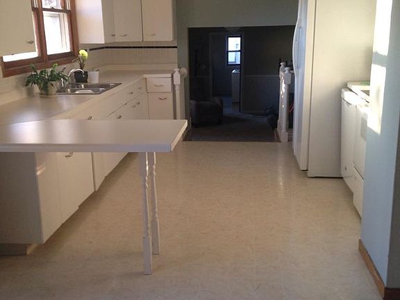 Kitchen looking toward Family Room with Laundry in the far background