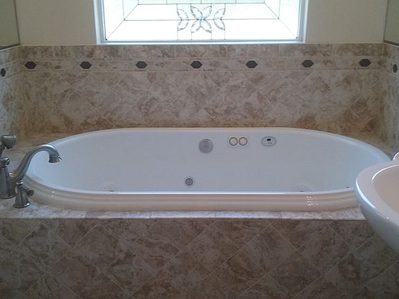 Jacuzzi tub in guest bath