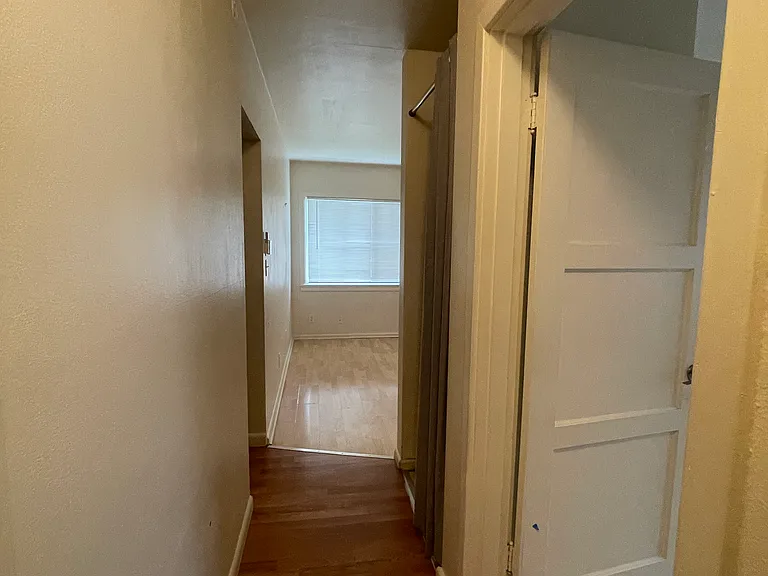 Hallway from main living room to bedroom and bathroom.