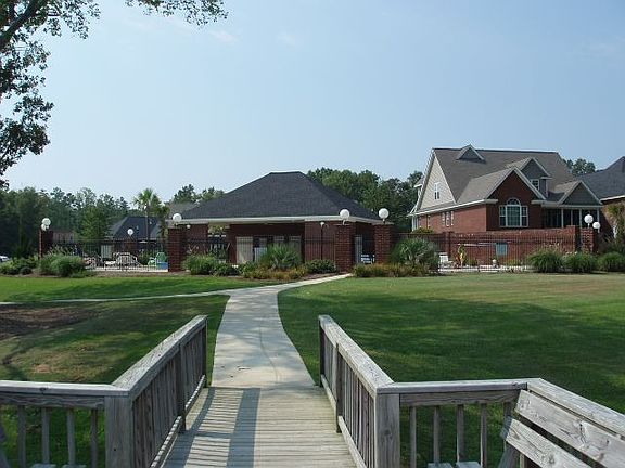 View of pool and cabanda from dock