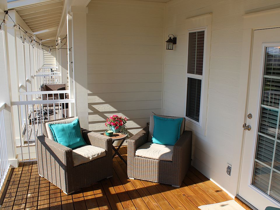 Private, covered second story porch with a great pool view.