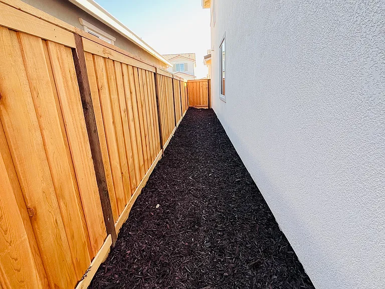 Backyard with w/ low maintenance mulch