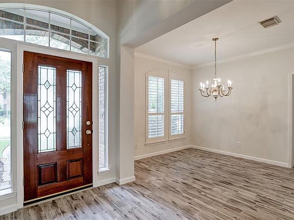 View of entryway and formal dining room. Formal dining room easily fits 8 and offers easy access to the kitchen.
