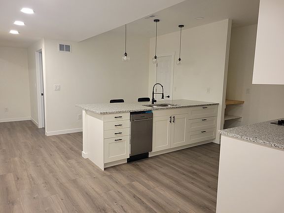 Fully-equipped kitchen with all-new stainless-steel appliances.