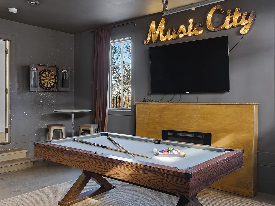 Pool table, darts and smart TV located in the garage! Still room for 1 car to park, or we can remove those items and you can use both sides of the garage to park in.