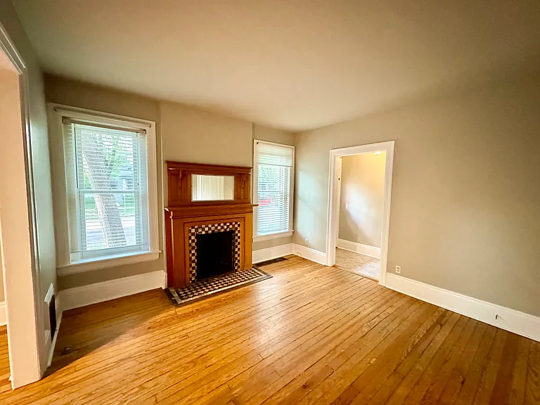 Large living room with charming (non-functional) fireplace