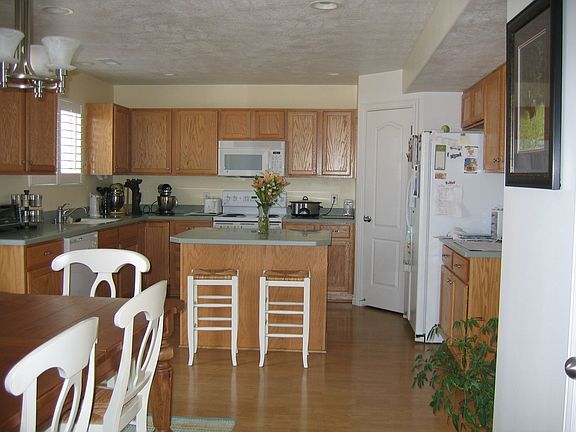 Kitchen with corian countertop.