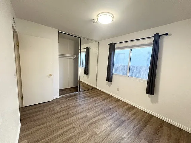 2nd bedroom (repainted and replaced brown carpet with new flooring)