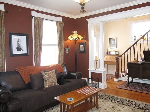 Come in through the front door and go right up the stairs or enter the living room.  High ceilings and new molding, hardwoods gleam!