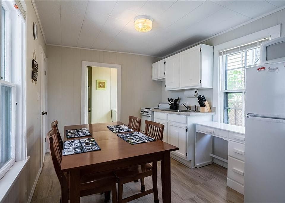 Kitchen equipped with all essentials including pots, pans, b