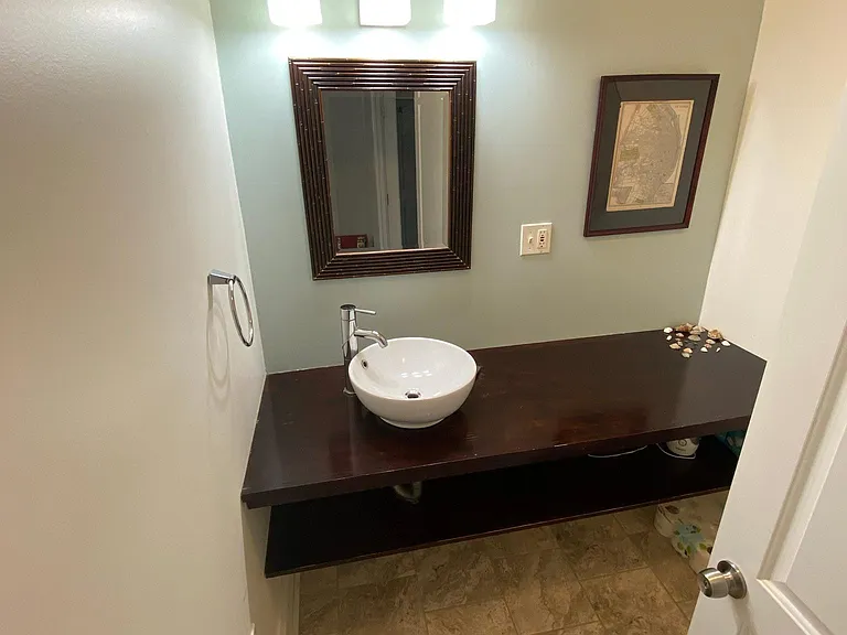 Main Floor bathroom. Sink and toilet.