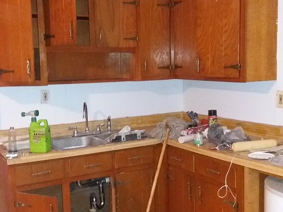 Kitchen cabinets. (Wood floors, walls painted, new ceiling tiles).