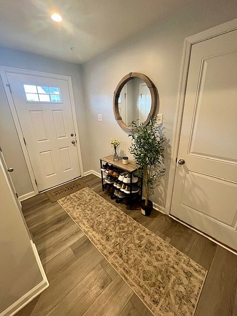 Front door and inside entrance to garage
