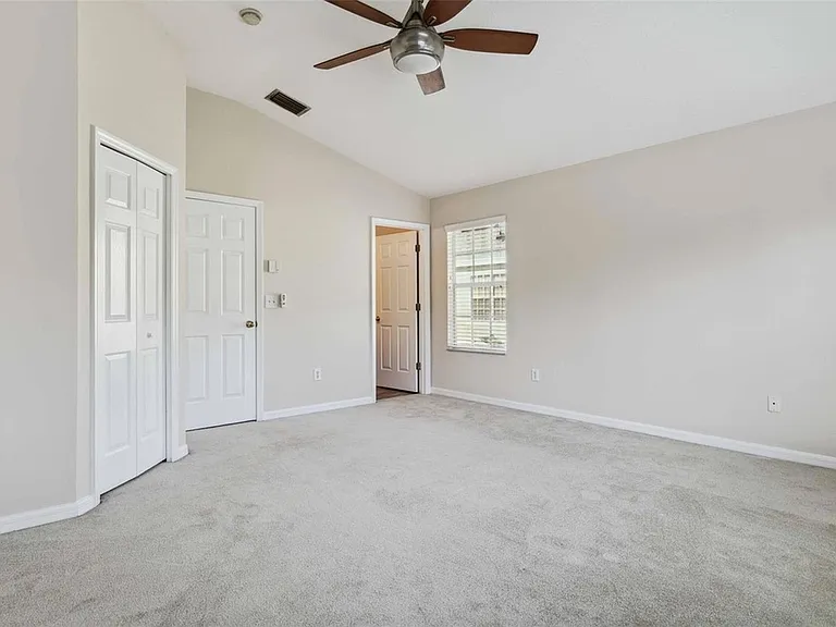 Master bedroom upstairs with walk in closet and bathroom and pond view