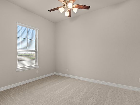 The formal living area is a perfect blend of style and functionality providing an inviting space for