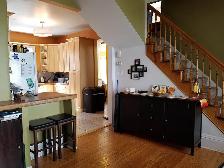 The washer and dryer are in hallway behind the large panty in picture
