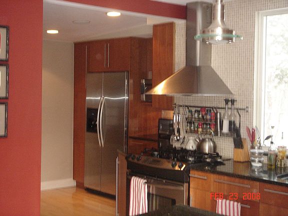 Stainless, granite and tumbled marble kitchen, cherry cabinets