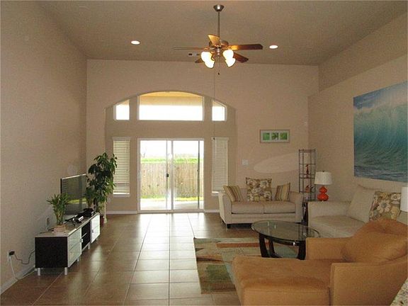 Arch back door overlooking private backyard with beautiful n