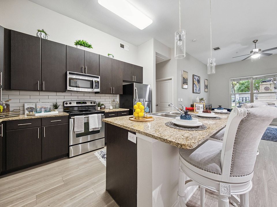 Modern Kitchen with Stainless Steel Appliances at Addison Keller Springs, Addison, TX