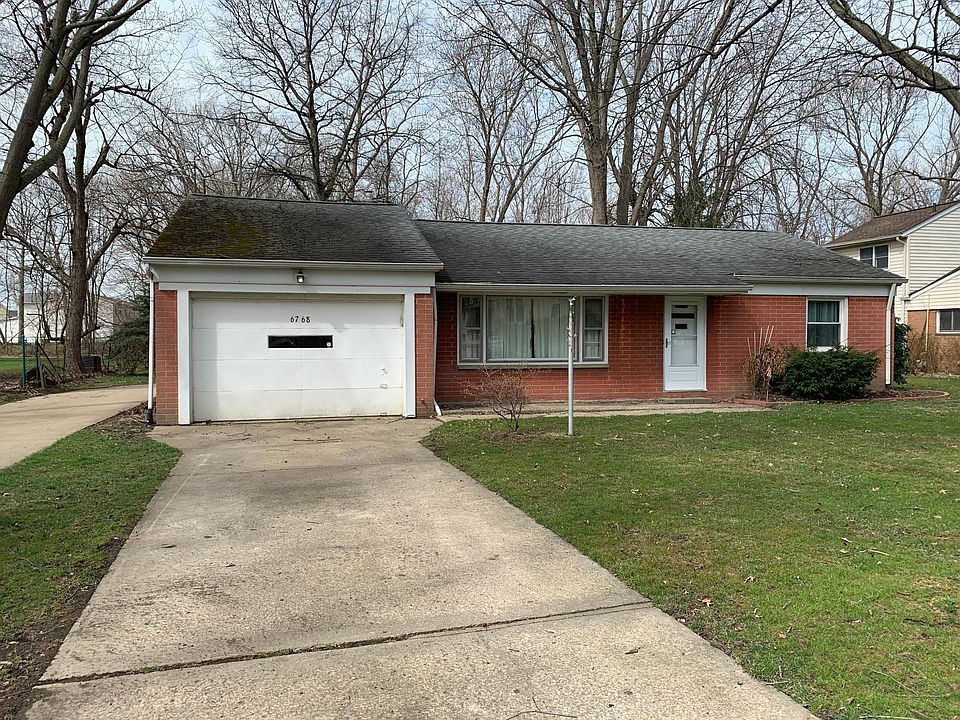 Front of the house. Attached one car garage with porch out front