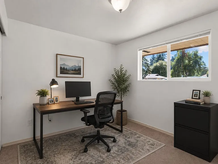 2nd bedroom with closet staged as home office