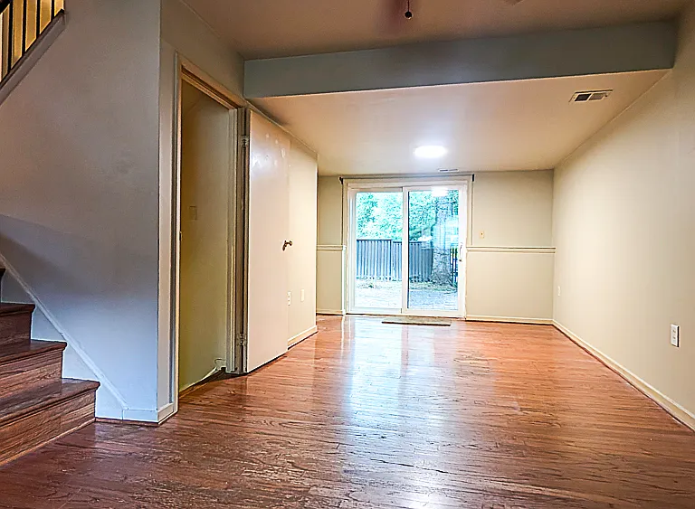 Lower level family room, sliding door open to the backyard