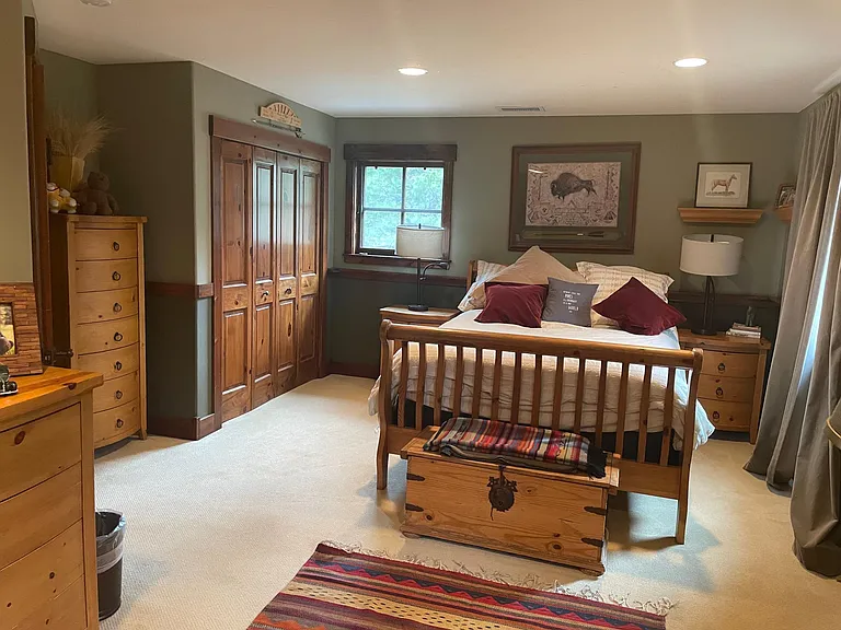 Upstairs bedroom with built in desk. The full bathroom is across the hall