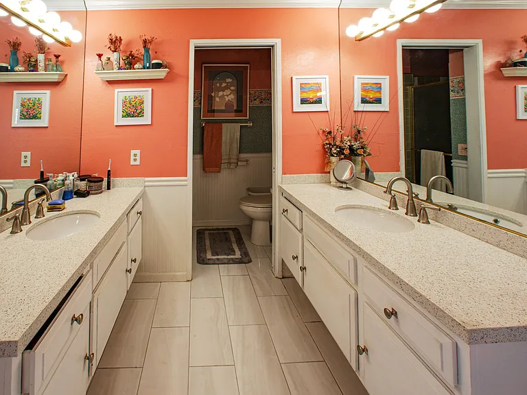 Master bathroom, as seen here, two new vanities and new tile floors.