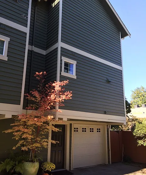 House from the courtyard with main entrance and garage.