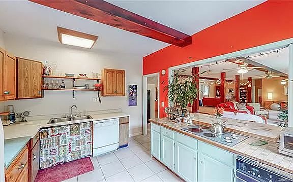 Kitchen - furnished. Looking into large main room before that floor was redone.