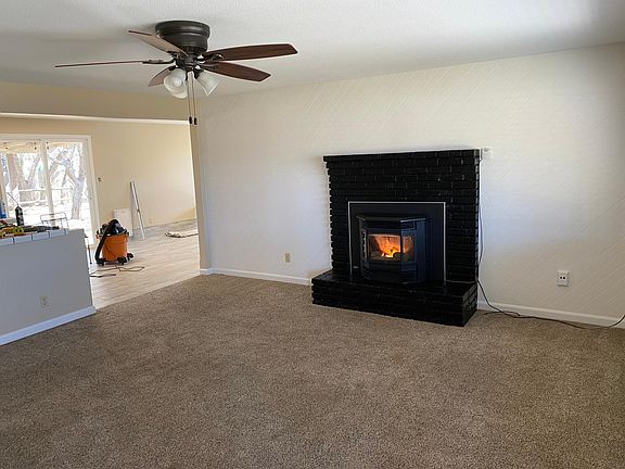 This view is from the front door looking into the kitchen/dining/rec room area