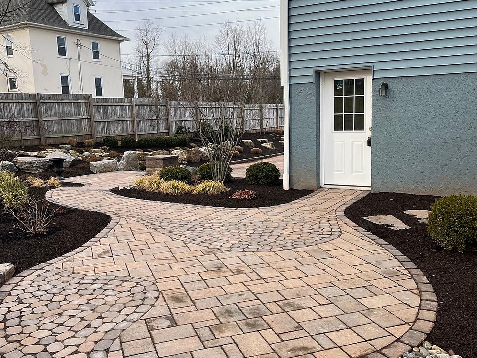 Private patio area at the back of the apartment. Lawn area above patio
