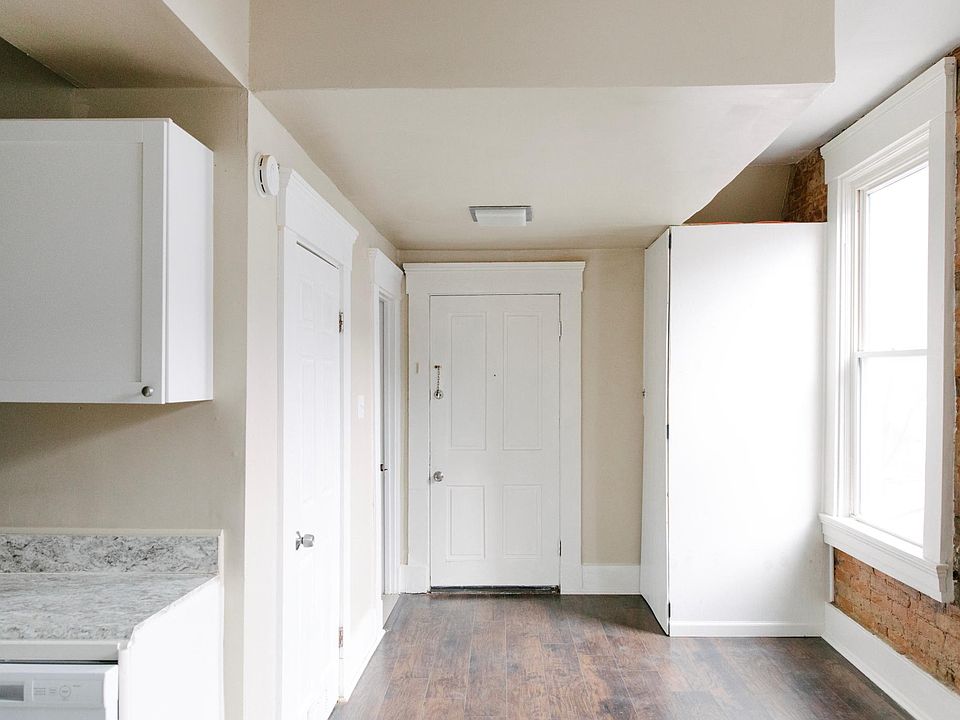 Front door entryway with two windows that get lots of natural light! Perfect spot for a kitchen/dining room table